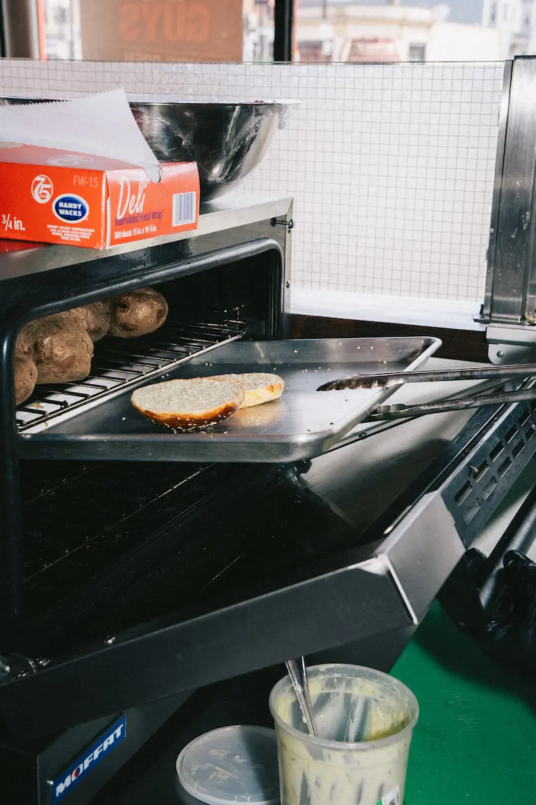 Turkish kumpir oven baking potatoes the Ortakoy way at FRIES B4 GUYS in Allston, Boston, served in-store only